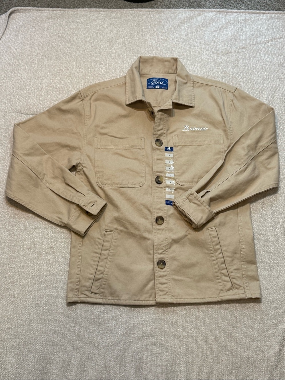 Brand new with tags, this official Ford Bronco utility chore jacket is a standou